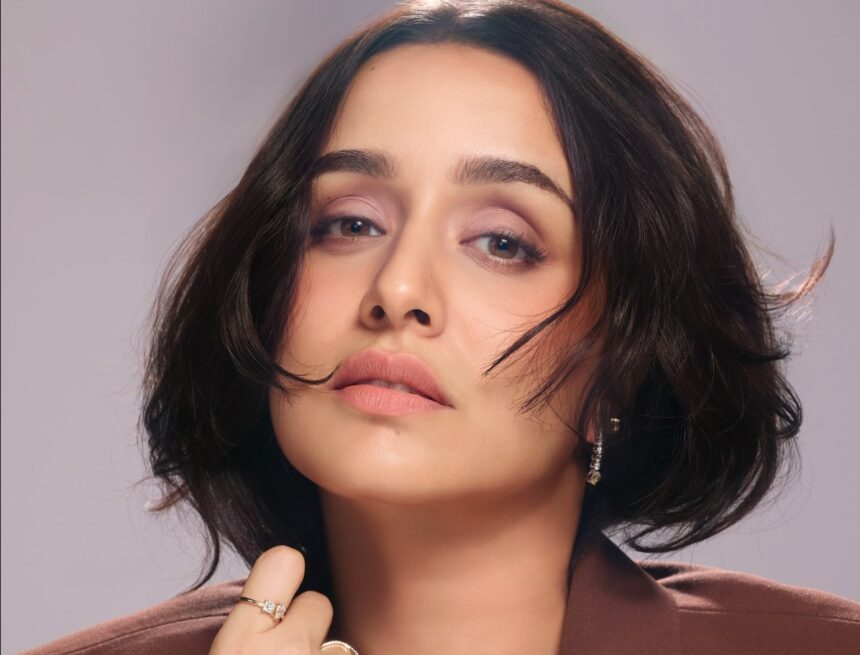Shraddha Kapoor in a stylish blazer with a messy bun showcasing a playful CEO-inspired look