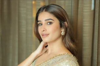 Rasha Thadani wearing a shimmering champagne-gold tissue silk saree with an embellished blouse