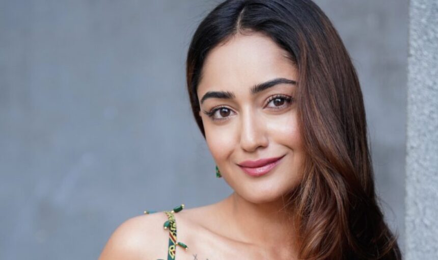 Tridha Choudhury in a vibrant green saree with a striking red border and embroidered blouse