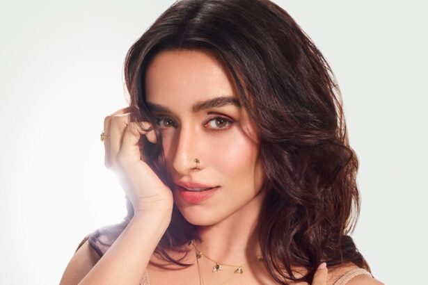 Shraddha Kapoor wearing a beige crochet top with layered gold jewellery in a sun-kissed fashion shoot