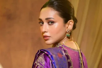 Mimi Chakraborty wearing a vibrant violet silk saree with royal blue border and gold detailing