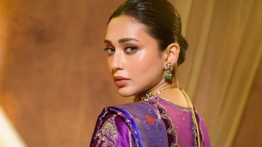 Mimi Chakraborty wearing a vibrant violet silk saree with royal blue border and gold detailing