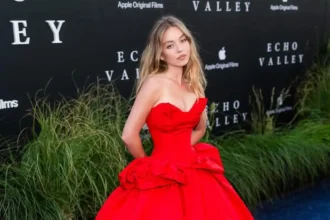 Sydney Sweeney wearing a dramatic scarlet ballgown in New York City