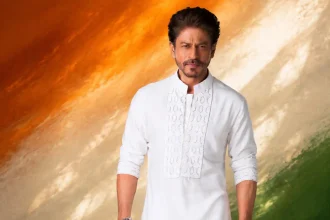 AI-generated Shah Rukh Khan in white traditional kurta against a saffron white and green Independence Day backdrop