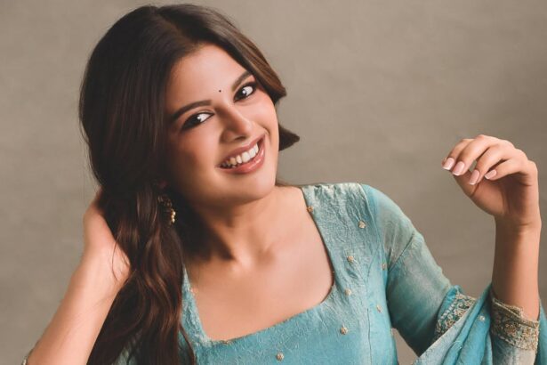Sanjana AK wearing a shimmering turquoise Anarkali by Akira The Couture