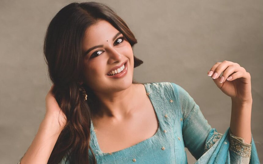 Sanjana AK wearing a shimmering turquoise Anarkali by Akira The Couture