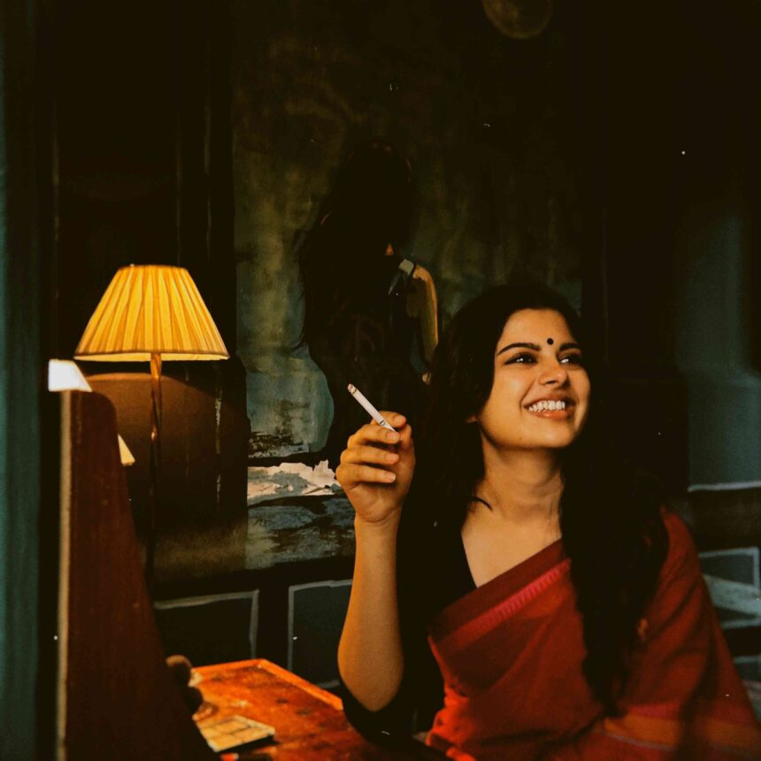 Sanjana Anand in a crimson red saree and black blouse for a vintage-inspired photoshoot