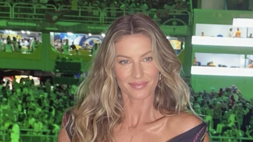 Hunterfly 2025 11 26 105357 Gisele Bündchen stuns in metallic blue gown with daring cutouts at Fashion Trust Arabia 2025