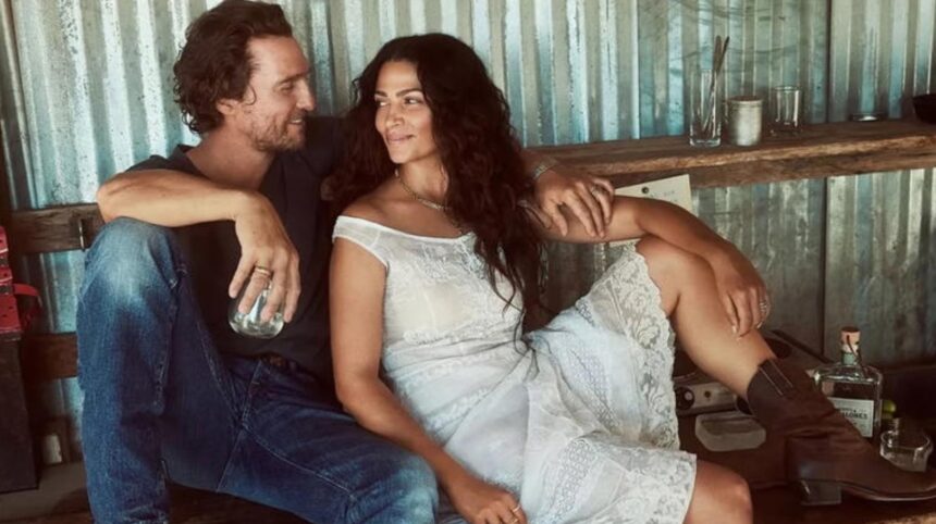 Matthew McConaughey and Camila Alves smiling together at an event