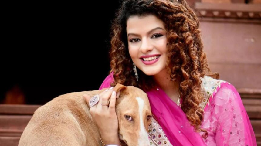Palak Muchhal performing on stage for charity concert