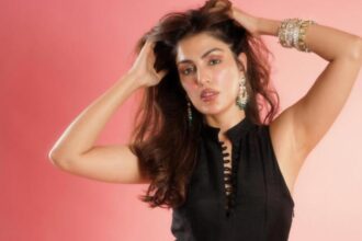 Rhea Chakraborty at Family Business launch event, smiling in a chic outfit