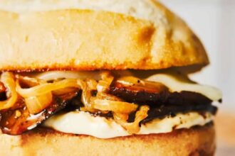 Portobello French Dip sandwich with roasted mushrooms, Provolone, caramelized onions, and horseradish aioli