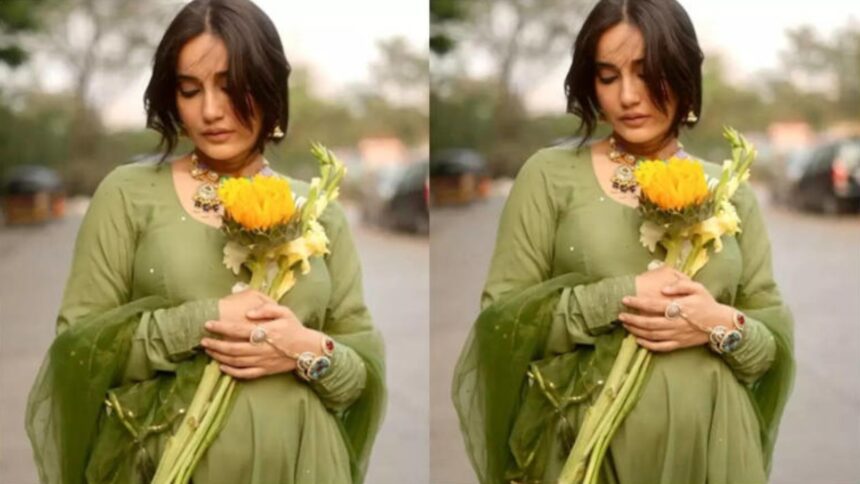 Surbhi Jyoti flaunting her baby bump in green salwar kameez