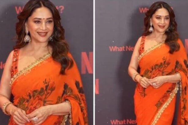 Madhuri Dixit in vibrant orange saree at Netflix India 2026 event