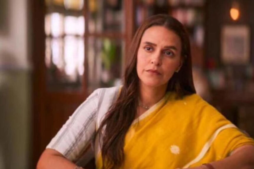 Neha Dhupia smiling during an interview, sharing insights about friendships in Bollywood