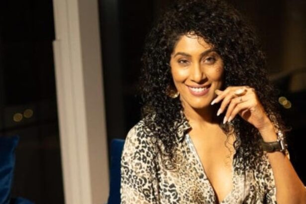 Shraddha Musale holding her debut book