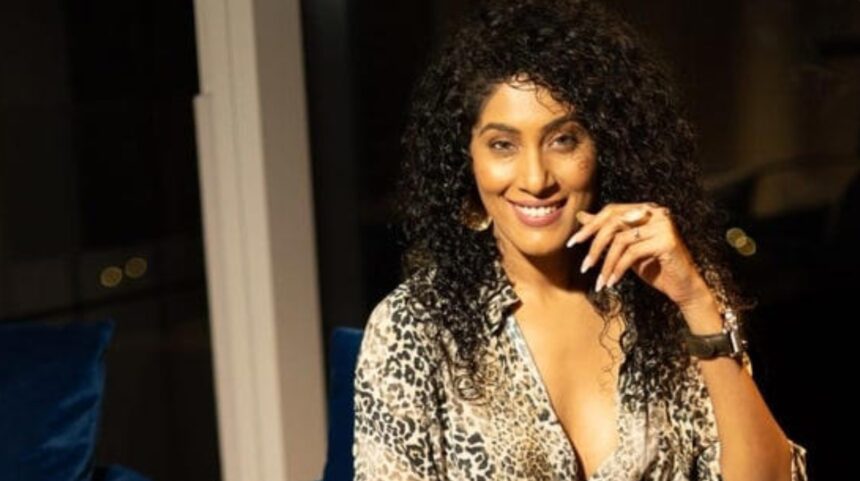 Shraddha Musale holding her debut book