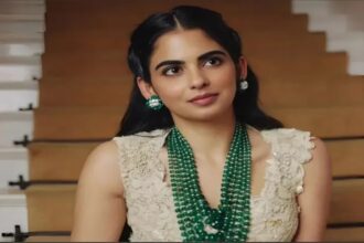 Hunterfly 2026 02 14 221818 Isha Ambani wearing an emerald-studded Anamika Khanna couture ensemble in antique gold tones