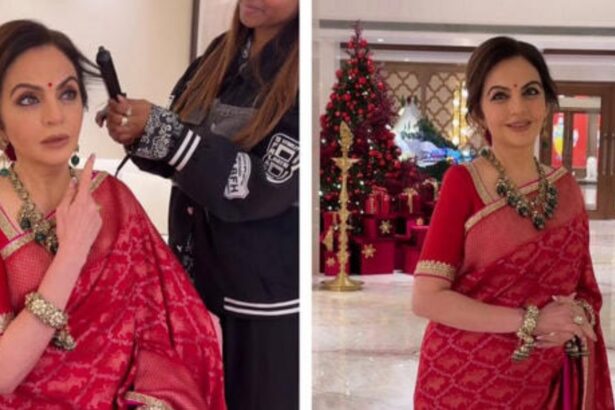 Hunterfly 6 02 05 213049 Nita Ambani wearing a red Swades saree and emerald necklace, giving hairstyling instructions
