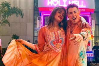 Nick Jonas and Priyanka Chopra celebrating Holi covered in colours