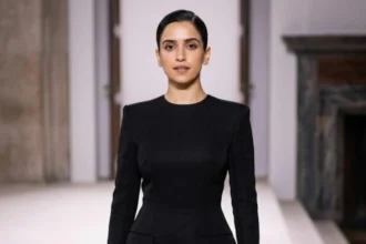 Sanya Malhotra posing in a stylish modern outfit with elegant fashion styling