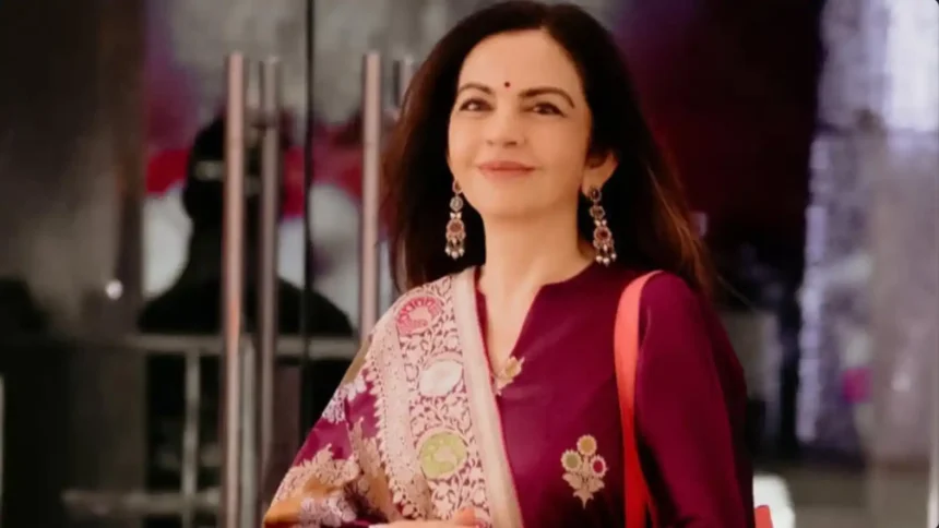 Nita Ambani wearing a handwoven Banarasi Butidar suit with Rangkat dupatta
