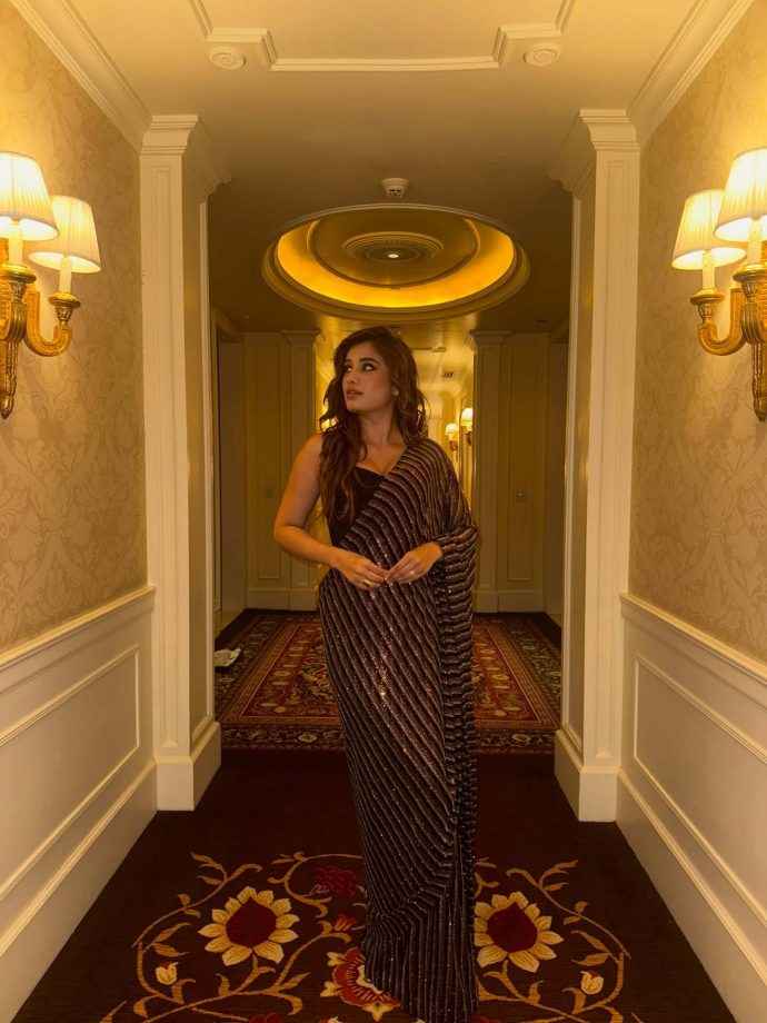 Hunterfly rasha thadani keeps it glam in a black shimmery saree 3