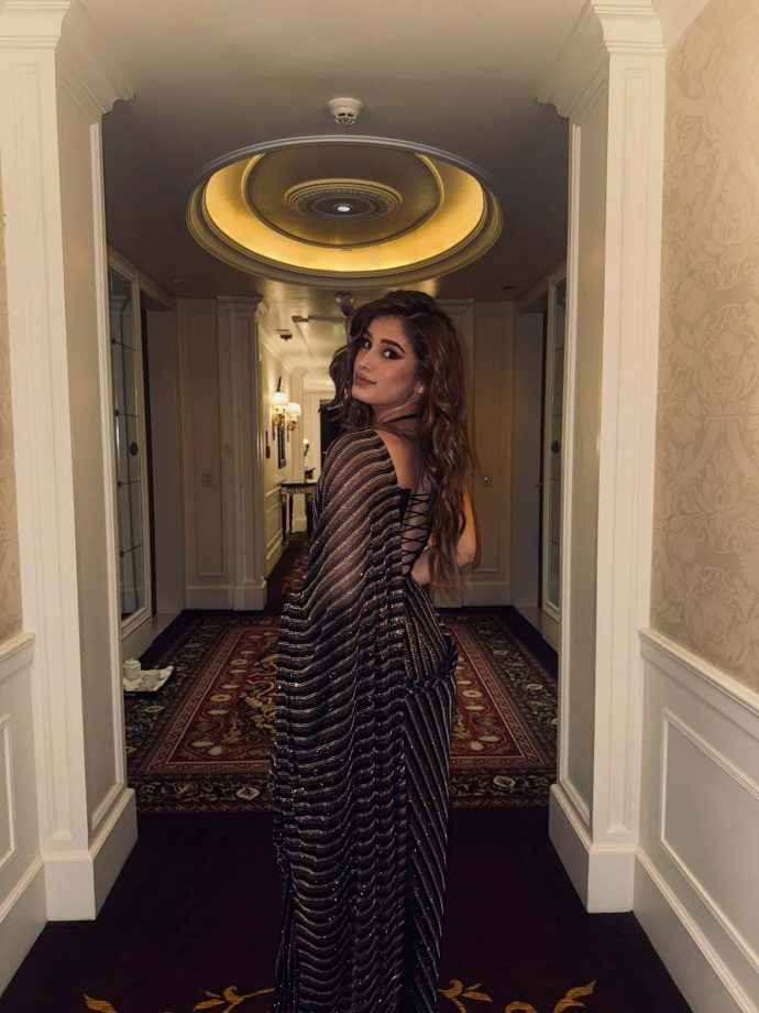 Hunterfly rasha thadani keeps it glam in a black shimmery saree 4