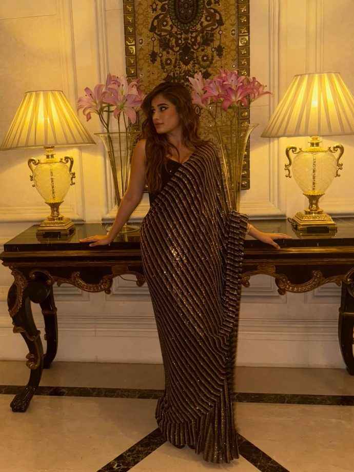 Hunterfly rasha thadani keeps it glam in a black shimmery saree 5