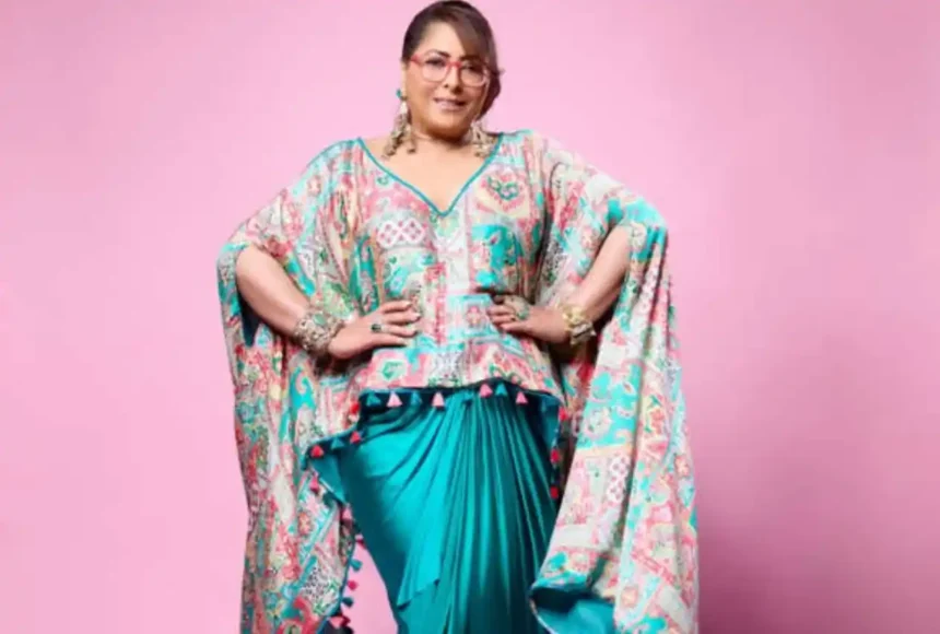 Geeta Kapur wearing a vibrant festive outfit showcasing elegant statement dressing and modern ethnic fashion.