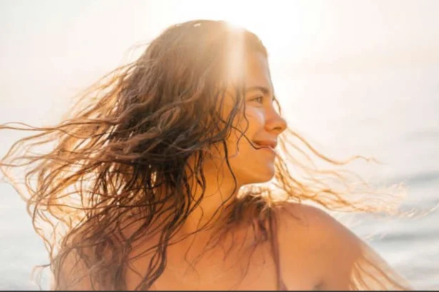 Hunterfly 06 26 182240 Woman with healthy shiny hair enjoying summer sunshine while following seasonal haircare tips