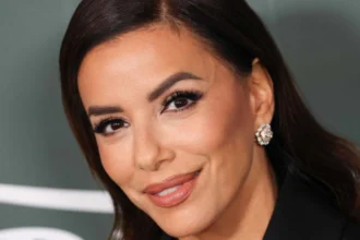 Eva Longoria wearing a polished nude lip makeup look at a public event