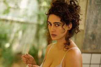 Actress Megha Shukla posing in a grey outfit for a minimalist Instagram photoshoot