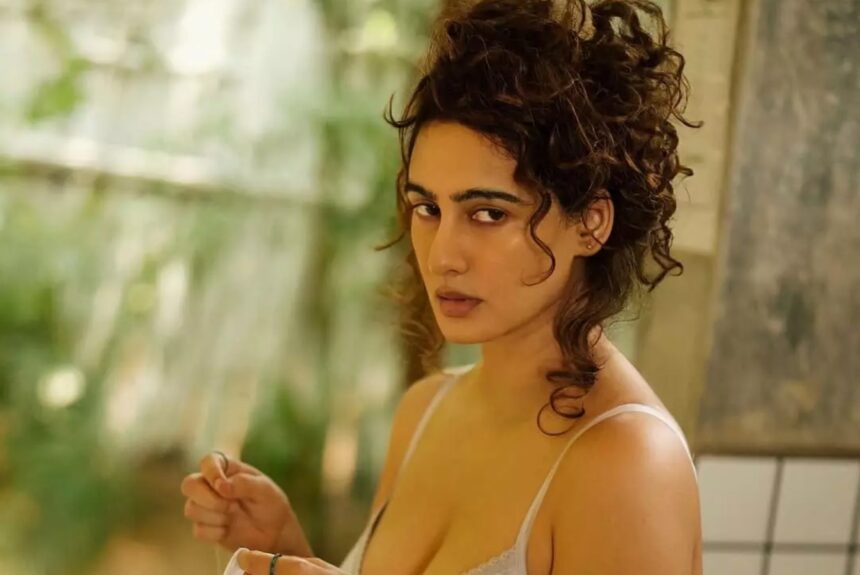 Actress Megha Shukla posing in a grey outfit for a minimalist Instagram photoshoot
