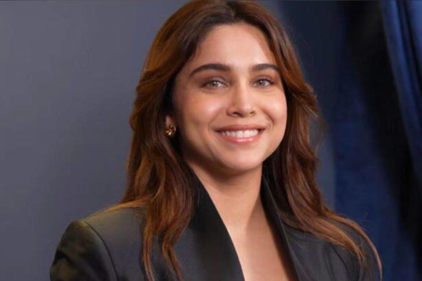 Sharvari wearing an all-black designer outfit with gold accents