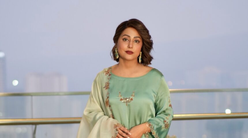Hina Khan wearing a mint green embroidered ethnic outfit during a fashion photoshoot.