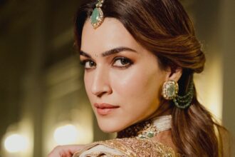 Hunterfly 026 07 26 104551 Kriti Sanon wearing an ivory-and-gold Manish Malhotra couture ensemble with emerald jewellery.