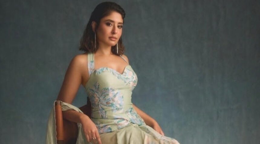 Kritika Kamra posing in a minimalist outfit during a fashion photoshoot.