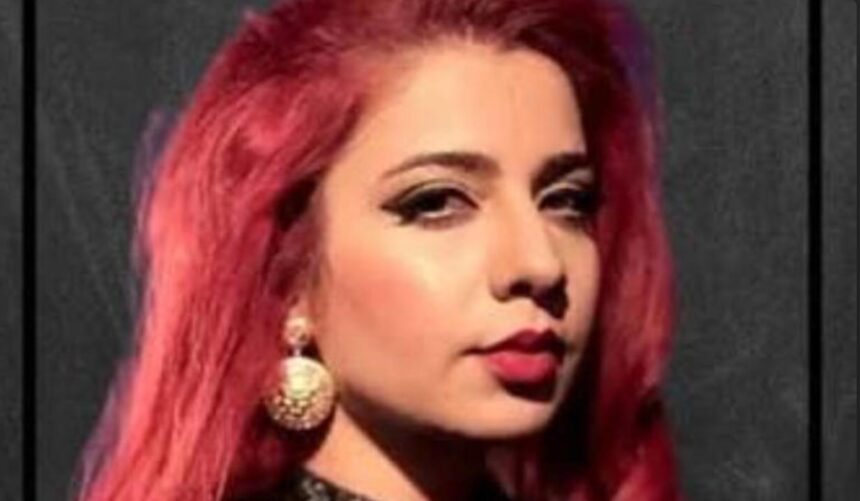 Jasmine Sandlas performing live during her Bengaluru concert as fans cheer.