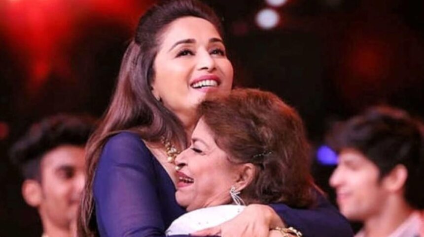 Madhuri Dixit with legendary choreographer Saroj Khan during a film event
