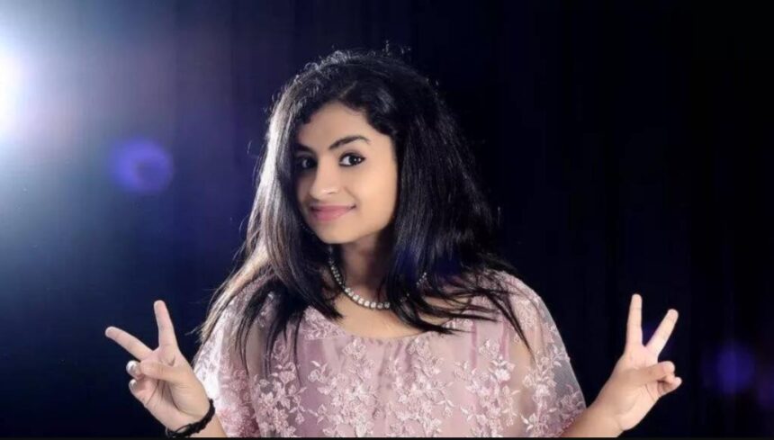 Singer and actress Sivaangi Krishnakumar smiling during a television appearance