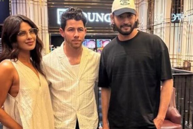Priyanka Chopra, Nick Jonas and Mahesh Babu pose together during a movie night at AMB Cinemas in Hyderabad.