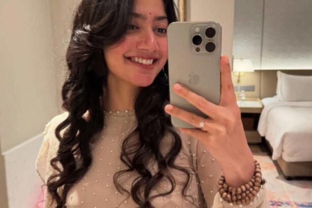 Hunterfly 026 07 31 095026 Sai Pallavi wearing a jaap mala during a public appearance.