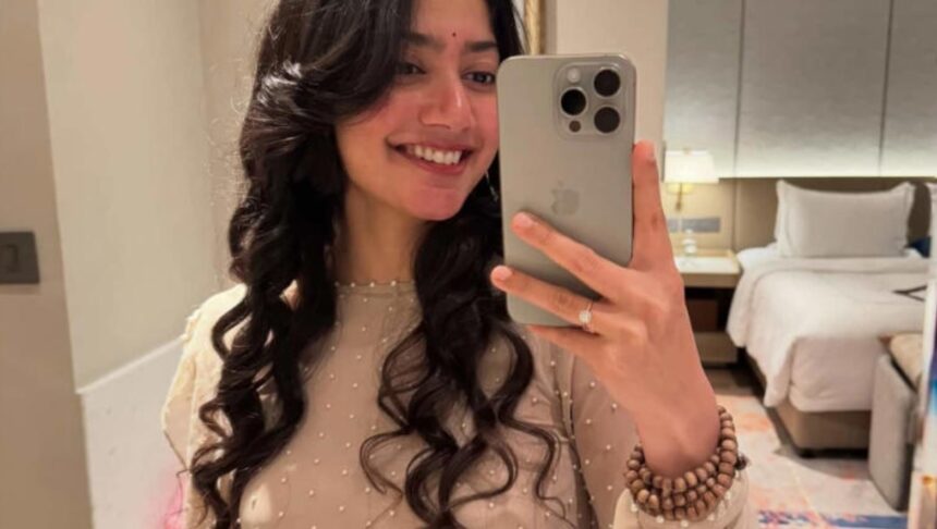 Sai Pallavi wearing a jaap mala during a public appearance.