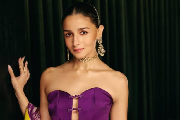Alia Bhatt wearing a jade green Rajiramniq kurta set during wedding festivities, styled with gold chandbali earrings and minimal makeup
