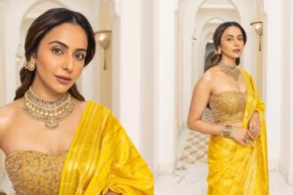 Rakul Preet Singh wearing a yellow silk saree with kundan jewellery at the Ramayana promotional event in New Delhi