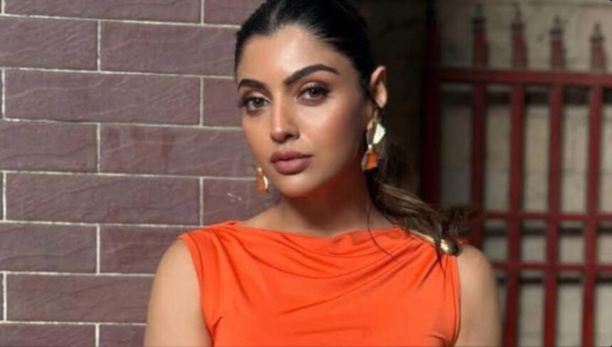 Actor Akanksha Puri speaking during a media interaction.