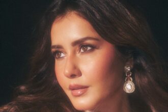 Raashii Khanna wearing a shimmering golden couture gown with a glittering cape by Dolly J Studio.