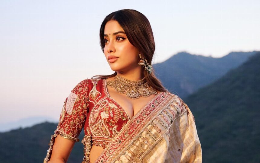 Hunterfly 2026 07 26 103431 Janhvi Kapoor wearing an ivory-and-gold embroidered saree and a champagne-gold embellished ensemble.