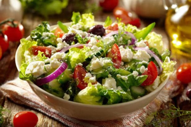 Fresh healthy salad bowl with vegetables, chickpeas, seeds, and olive oil dressing.